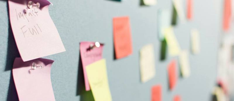Planning notes pinned to a project board